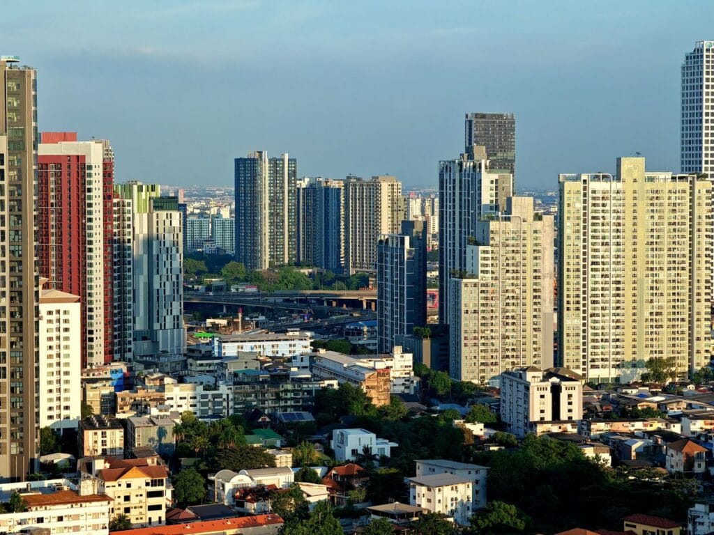 Modern city skyline with high-rise buildings under a clear sky during the day.